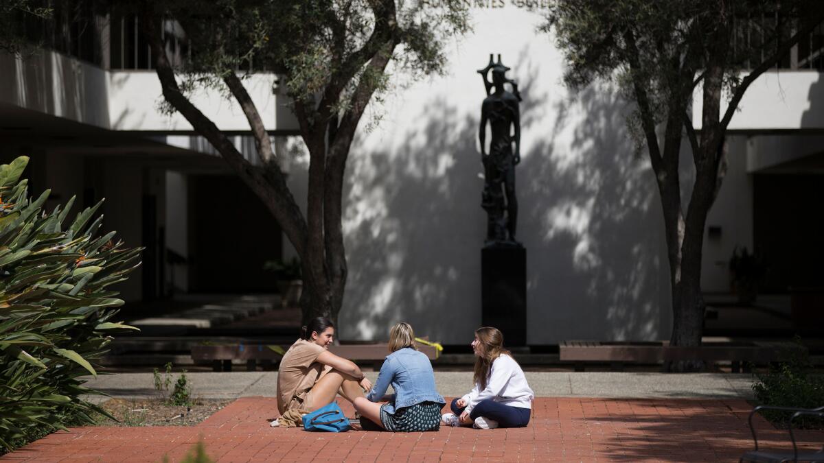 Students sit on the campus of Scripps College, one of the Claremont colleges that gives the community its upscale, progressive tone. The citizens of Claremont have mounted a campaign to take over the city's private water company.