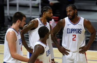 LOS ANGELES, CALIFORNIA - DECEMBER 17: Kawhi Leonard #2, Paul George #13 Ivica Zubac #40 and Reggie Jackson.