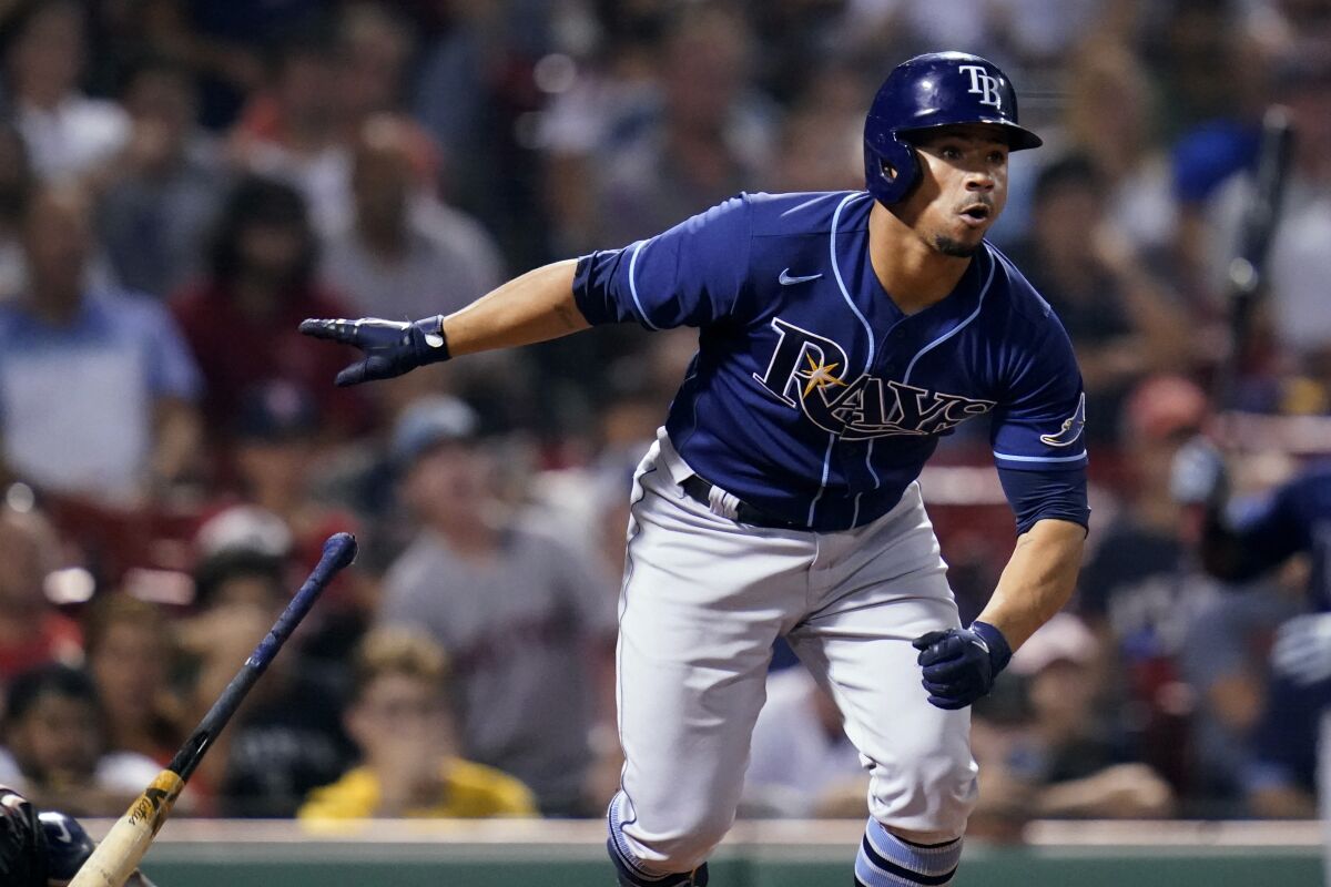 Tampa Bay Rays' Francisco Mejia watches the flight of his single during the ninth inning of the team's baseball game against the Boston Red Sox at Fenway Park, Tuesday, Aug. 10, 2021, in Boston. There was an error on right fielder Hunter Renfroe; three runs score on the play. (AP Photo/Charles Krupa)