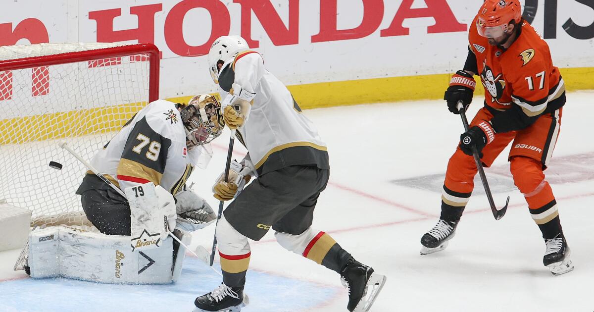 Anaheim, CA - May 10: Vegas Golden Knights defenseman Rasmus Andersson, #4, center, and goalie Carter Hart, #79, watch as Anaheim Ducks left wing Alex Killorn, #17, right, scores a goal in the second period during their 4-3 win in Game 4 of their Stanley Cup Western Conference semifinal playoff series at the Honda Center in Anaheim Sunday, May 10, 2026. (Allen J. Schaben / Los Angeles Times)
