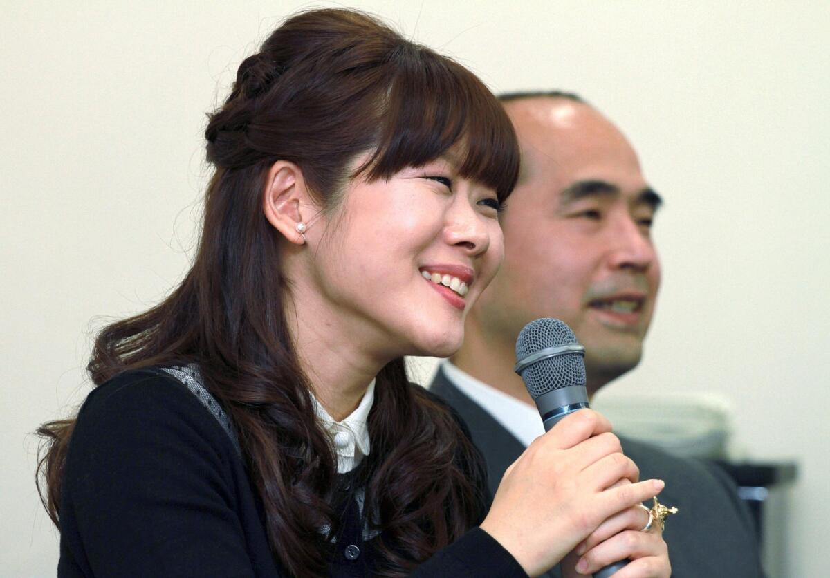 Japan's national institute Riken researcher Haruko Obokata announces in January that she discovered a simple way to turn animal cells back to a youthful, neutral state, a feat hailed as a "game-changer." Fellow researcher Teruhiko Wakayama, right, now says the reports should be withdrawn.