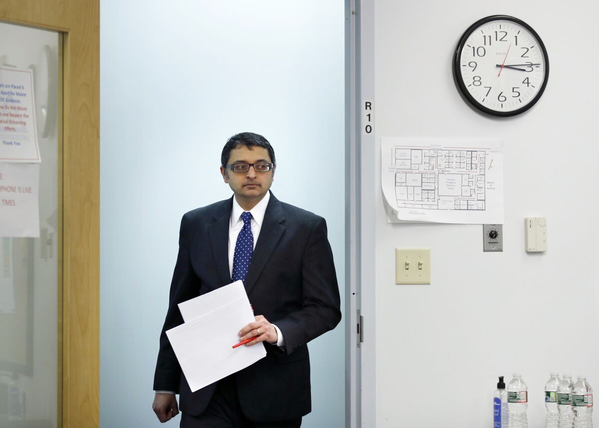 Dr. Nirav Shah arrives at a news conference in Augusta, Maine.