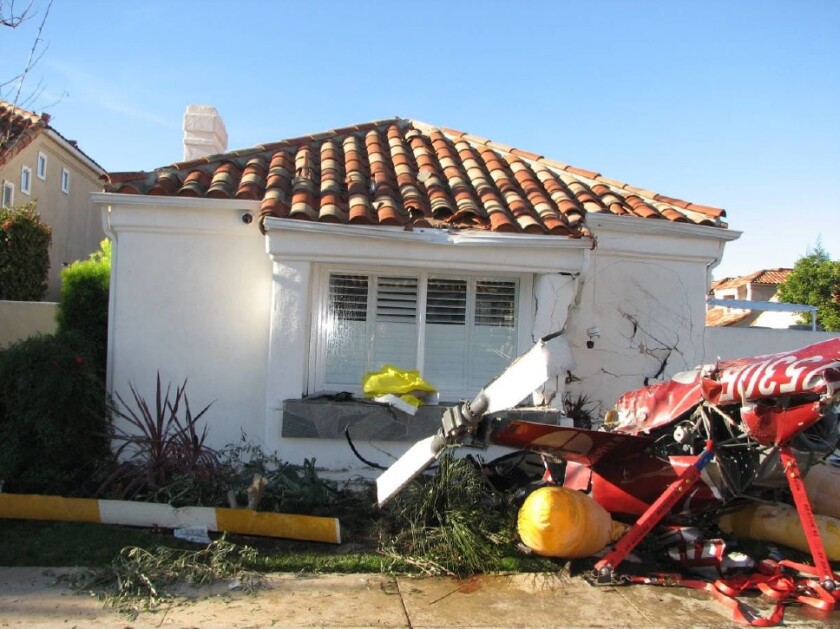 Investigators of the fatal crash of this Robinson R44 helicopter in Newport Beach said the pilot made no distress calls, though the sole survivor told police that the pilot told the passengers “something’s wrong.”