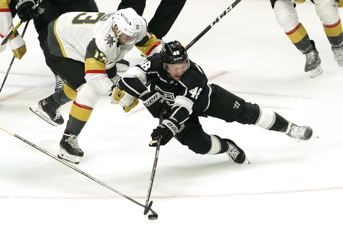 Kings left wing Brendan Lemieux falls while under pressure from Vegas Golden Knights left wing Tomas Jurco.