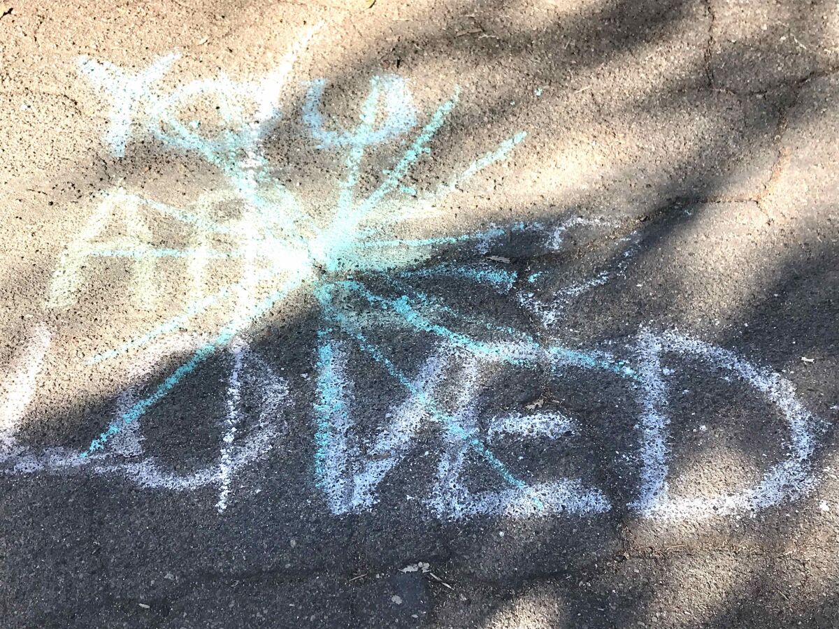Chalk drawings from a ChalkUp event on Thanksgiving in La Jolla were pictured defaced a week later.