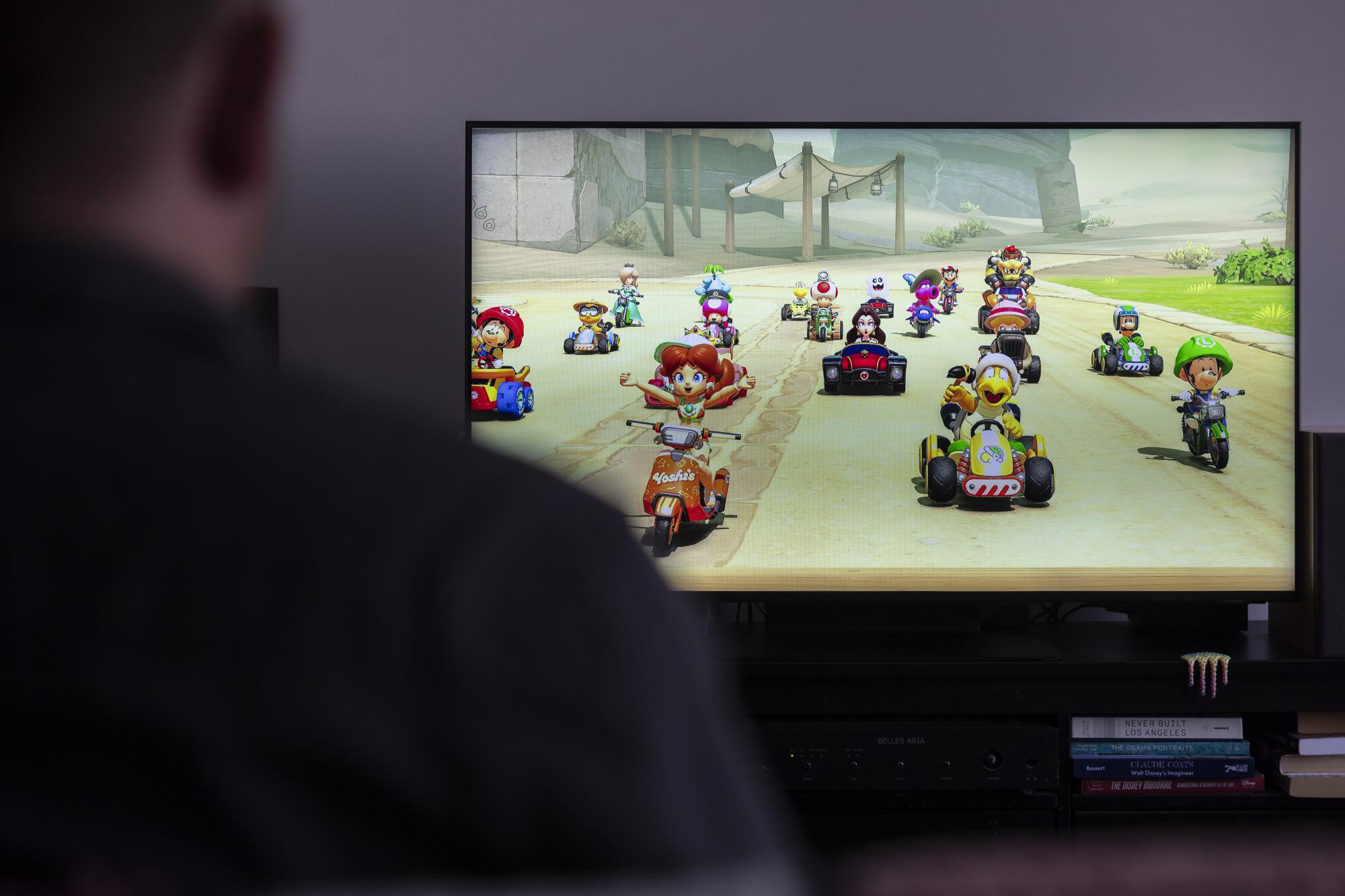 A television with "Mario Kart World."