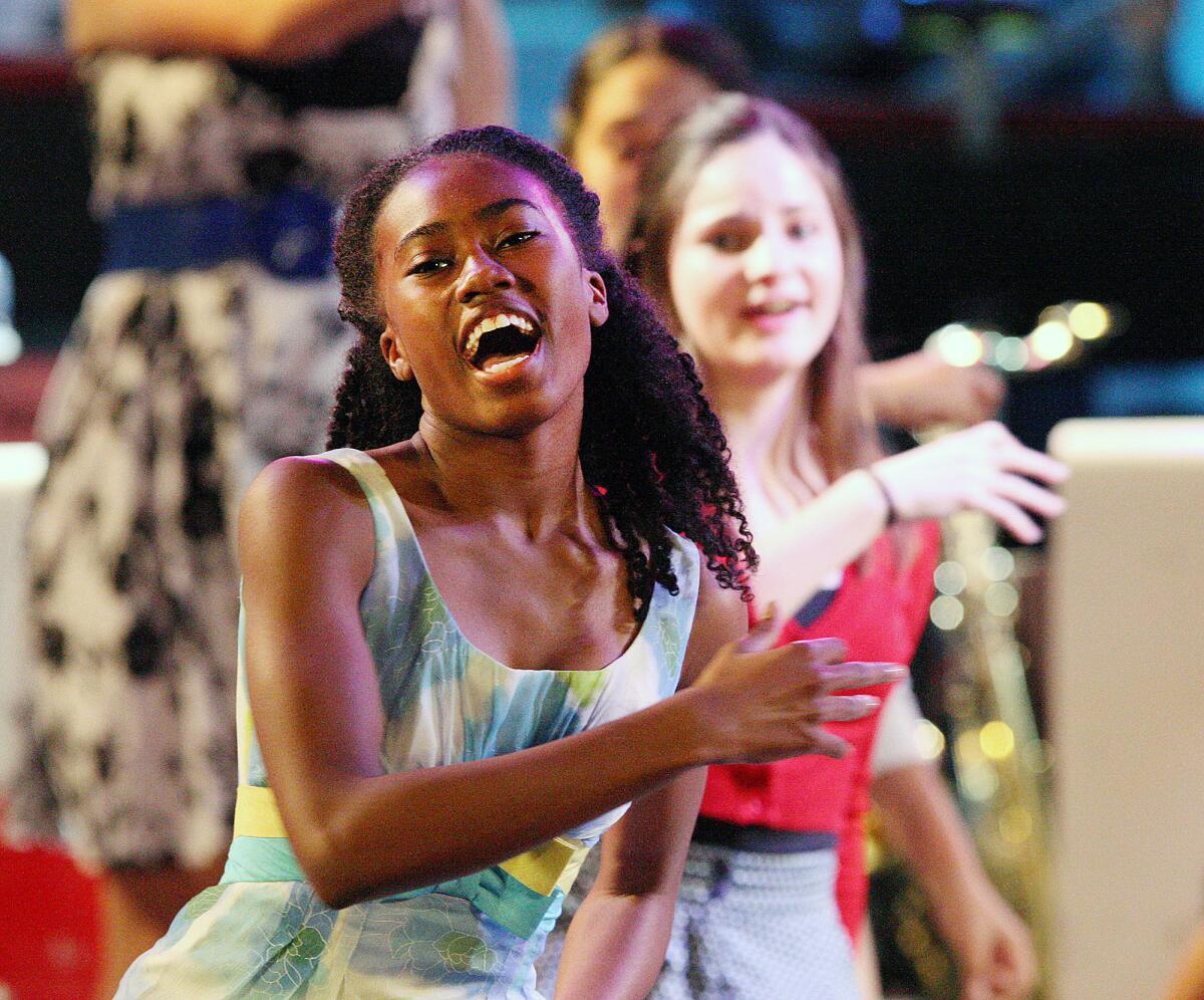 A dancer in the chorus sings and dances during the dress rehearsal Tuesday.