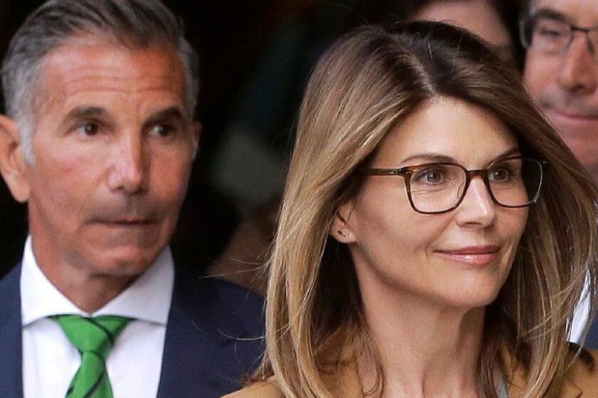 FILE - In this April 3, 2019 file photo, actress Lori Loughlin, front, and husband, clothing designer Mossimo Giannulli, left, depart federal court in Boston after facing charges in a nationwide college admissions bribery scandal. Loughlin and her husband Giannulli said in court documents Monday, April 15, 2019, that they are pleading not guilty to charges that they took part in a sweeping college admissions bribery scam. (AP Photo/Steven Senne, File)