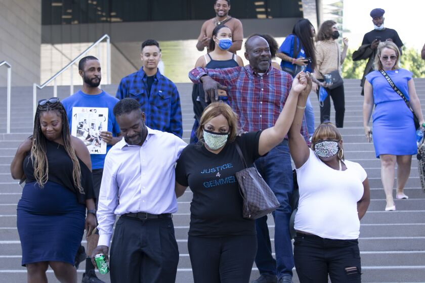 LOS ANGELES, CA - JULY 27: Dane Brown, second from left, a surviving victim and LaTisha Nixon, Gemmel Moore's mother (middle) and friends and family of the victims rejoice in the guilty verdict for Ed Buck on Tuesday, July 27, 2021 in Los Angeles, CA. (Myung J. Chun / Los Angeles Times)