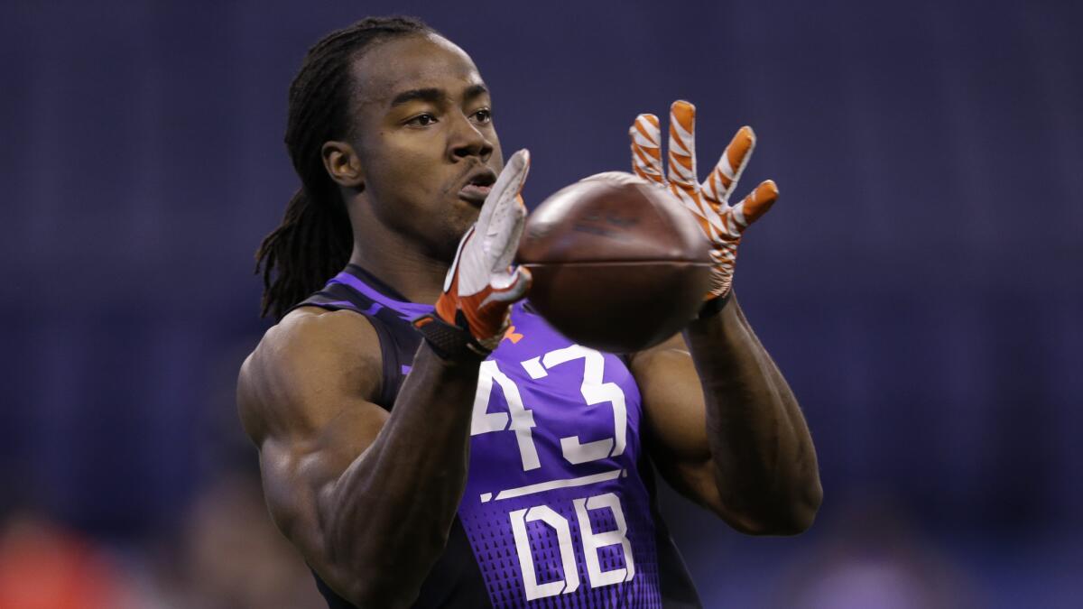 Former USC defensive back Josh Shaw makes a catch during a drill at the NFL Scouting Combine on Monday.