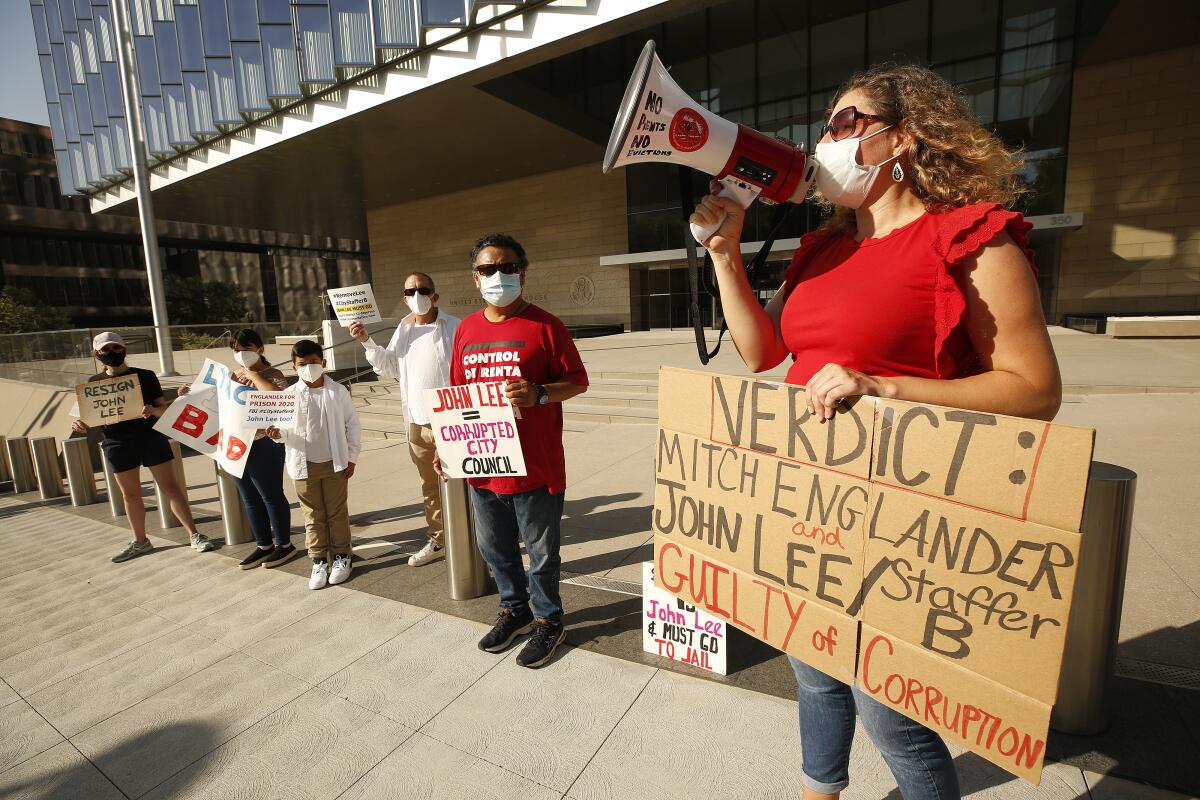 Pilar Schiavo of West Valley People's Alliance and others protest outside the federal court in Los Angeles.