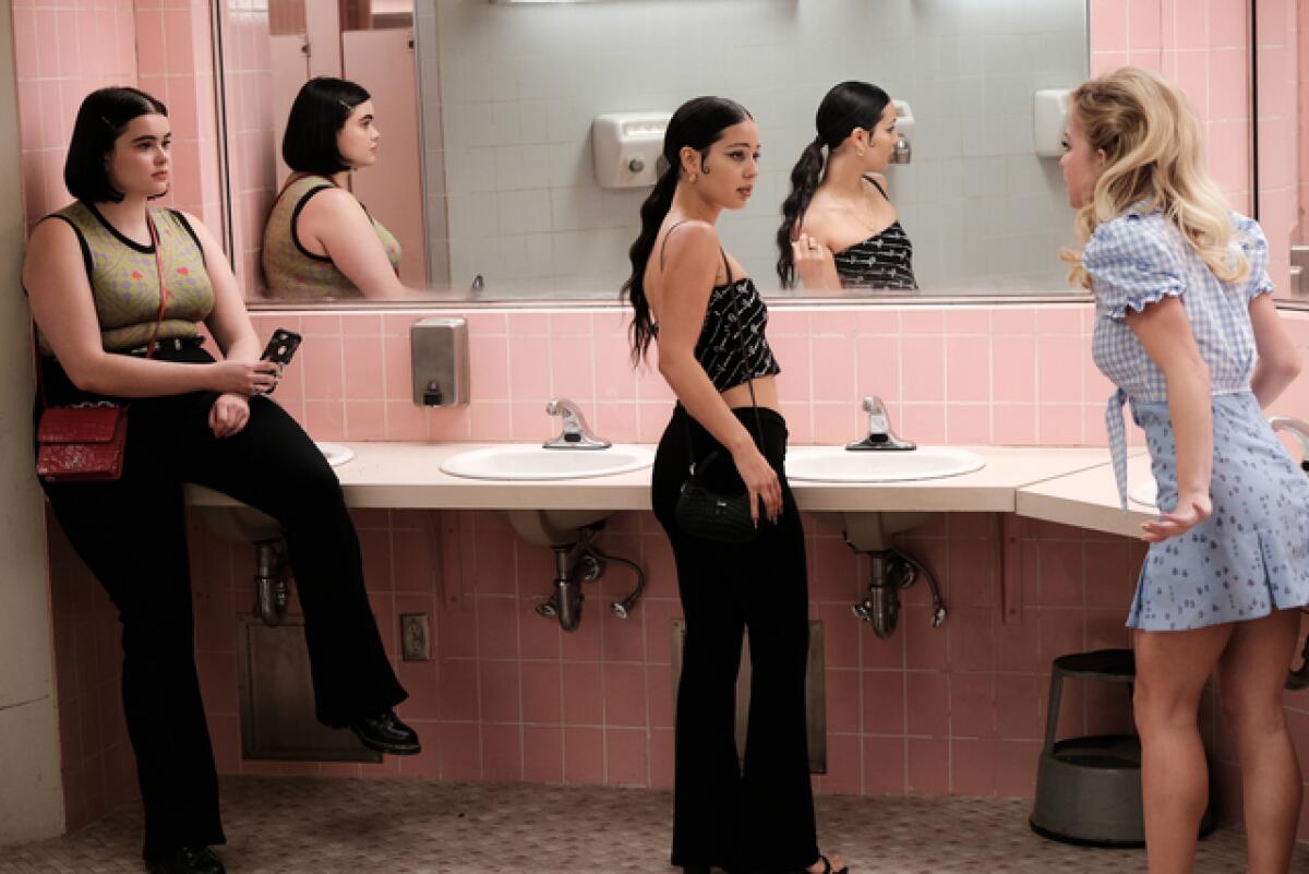 Barbie Ferreira, Alexa Demie and Sydney Sweeney standing in a pink high school bathroom