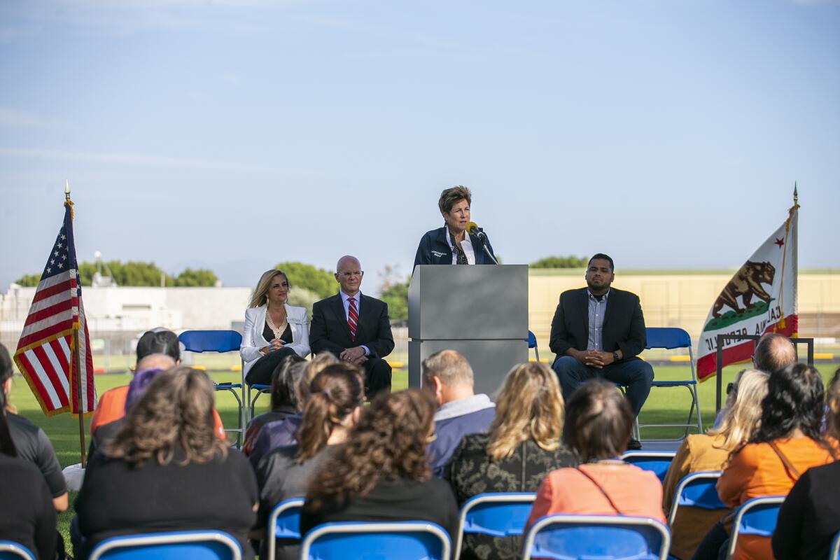 Mayor Barbara Delgleize speaks during the ribbon-cutting ceremony for Park View Park in Huntington Beach on Friday.