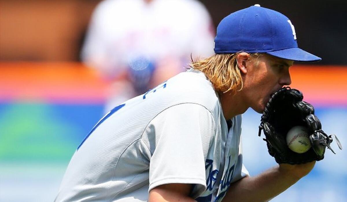 Dodgers pitcher Zack Greinke reacts after his scoreless inning streak ends against the Mets.