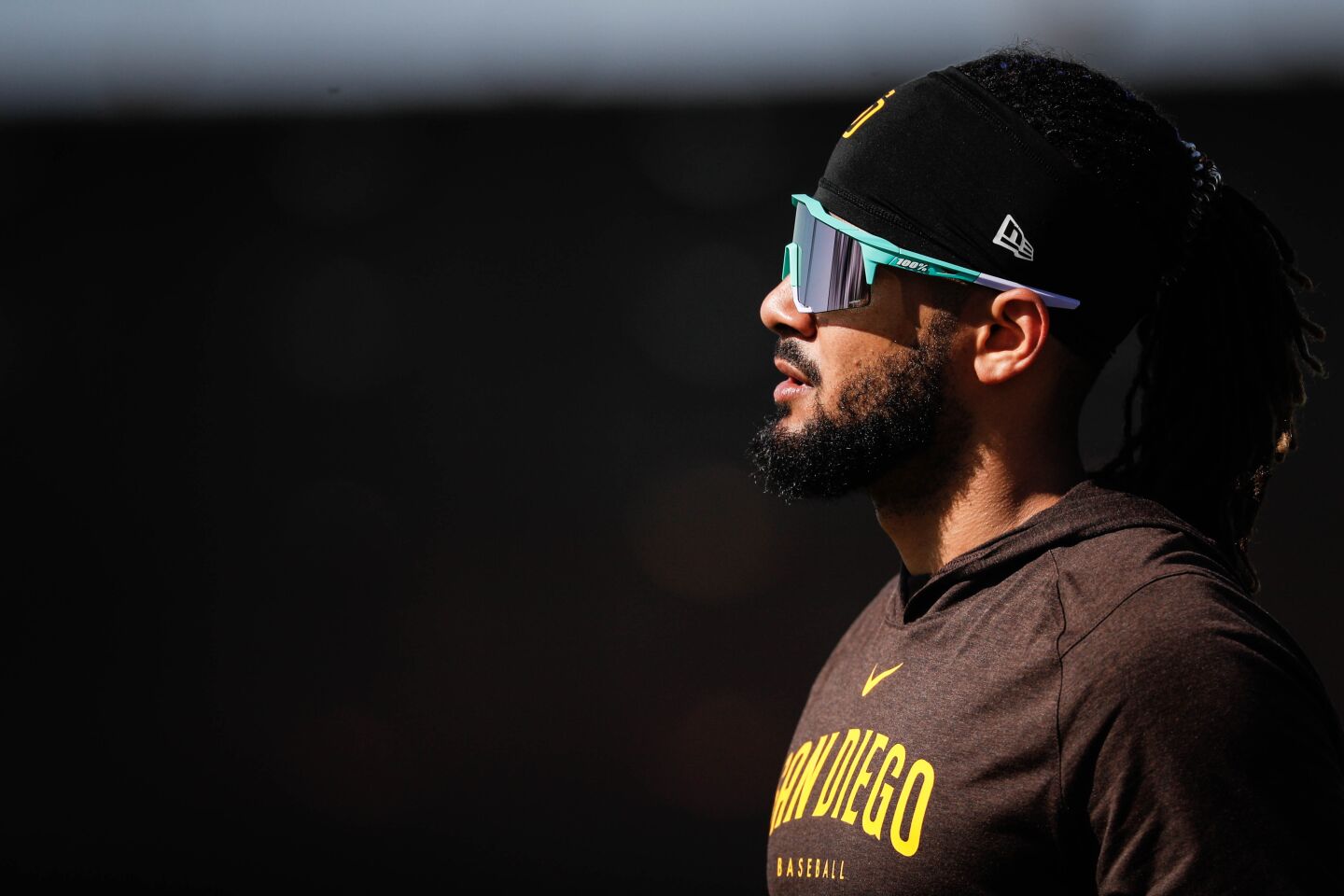 Padres' Fernando Tatis Jr. walks to batting practice during a spring training practice at Peoria Sports Complex on Thursday.