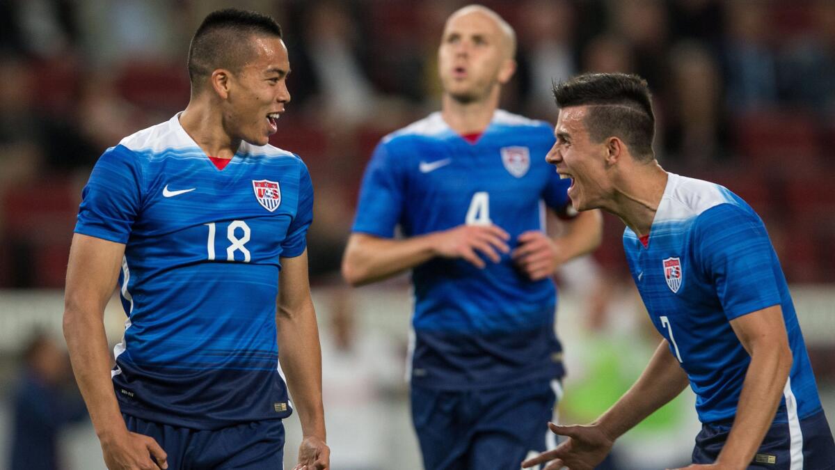 U.S. forward Bobby Wood, left, celebrates with teammate Alfredo Morales after scoring the winning goal in a 2-1 victory over Germany in an international friendly match on June 10, 2015.