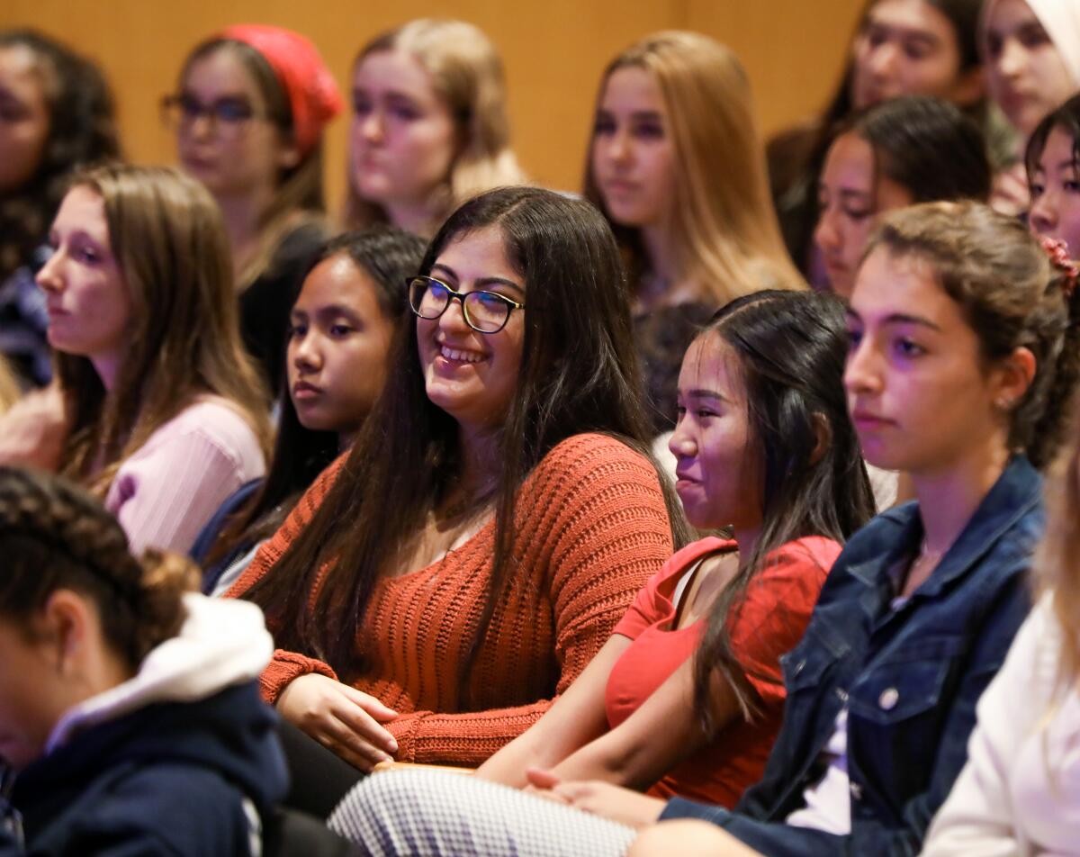 San Diego Unified School District high school students listen as Karen Nelson, president of the J. Craig Venter Institute, speaks at the Salk Institute about her scientific career.