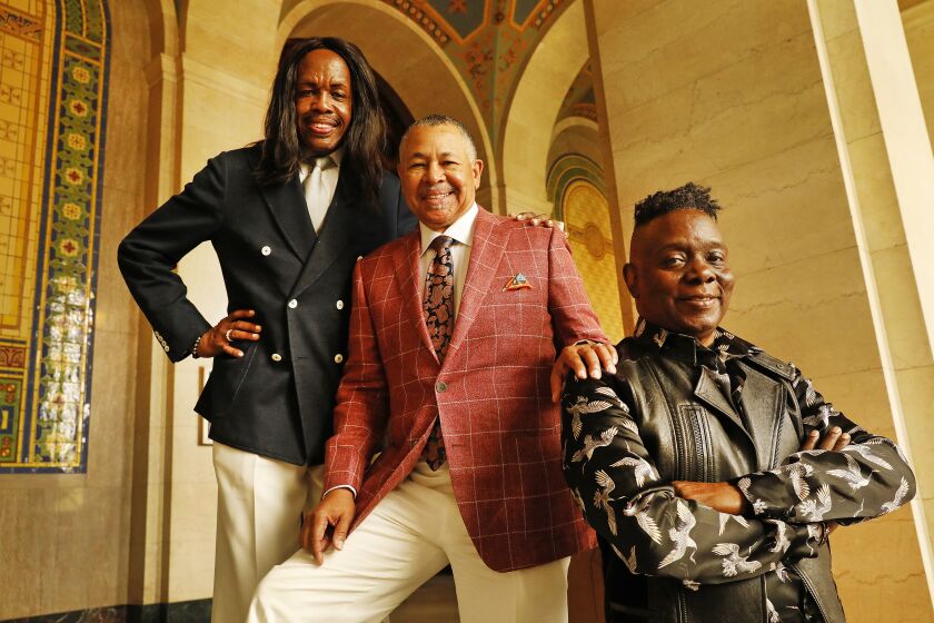 LOS ANGELES, CA - SEPTEMBER 10, 2019 The three principal members of the famous music group Earth Wind and Fire -- Verdine White, Ralph Johnson and Philip Bailey, left to right, visit Los Angeles City Hall where the band had a celebration regarding the establishment of EWF Day in L.A. that is pegged to the band's upcoming Hollywood Bowl shows and Kennedy Center Honors on September 10, 2019. (Al Seib / Los Angeles Times)