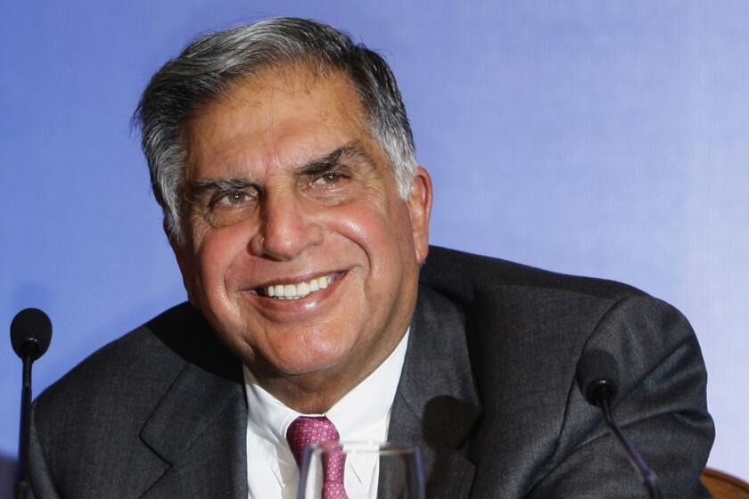 FILE - Tata Sons Chairman Ratan Tata reacts as he speaks during a press conference prior to the launch event of the Tata Nano in Mumbai, India, March 23, 2009. (AP Photo/Gautam Singh, File)