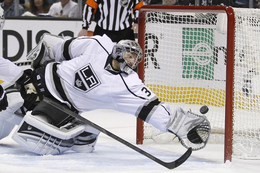 Kings goalie Jonathan Quick (32) can't stop a shot by San Jose Sharks center Joe Thornton (19) during the first period in Game 6.
