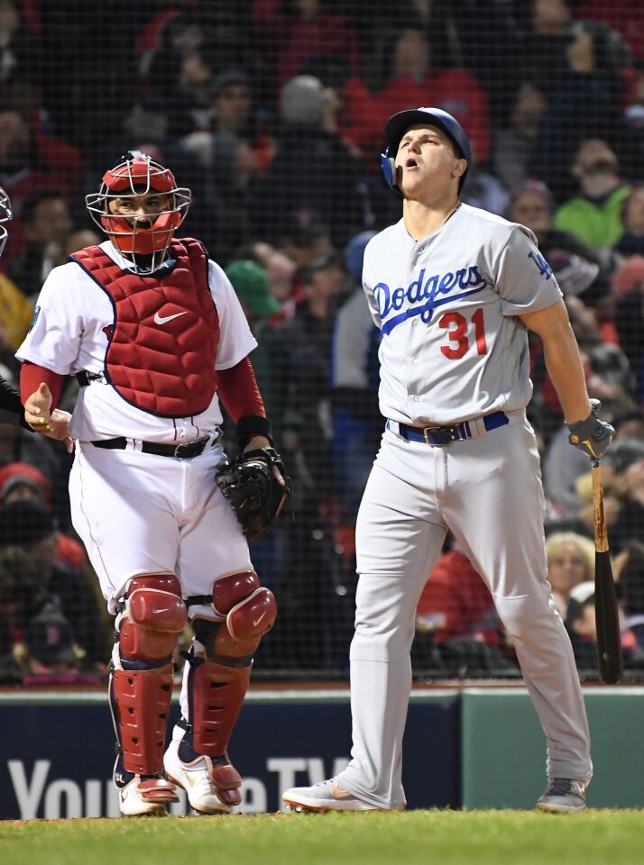 Dodgers Joc Pederson and Red Sox catcher Sandy Leon watches the ball go foul in the 7th inning.