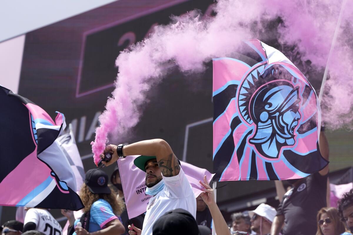 Inter Miami fans wave flags and flares before an MLS soccer match against  