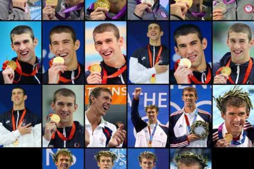 Michael Phelps shown with the 22 medals (18 gold, 2 silver, 2 bronze) he won during the Olympic Games in Athens, Beijing and London.