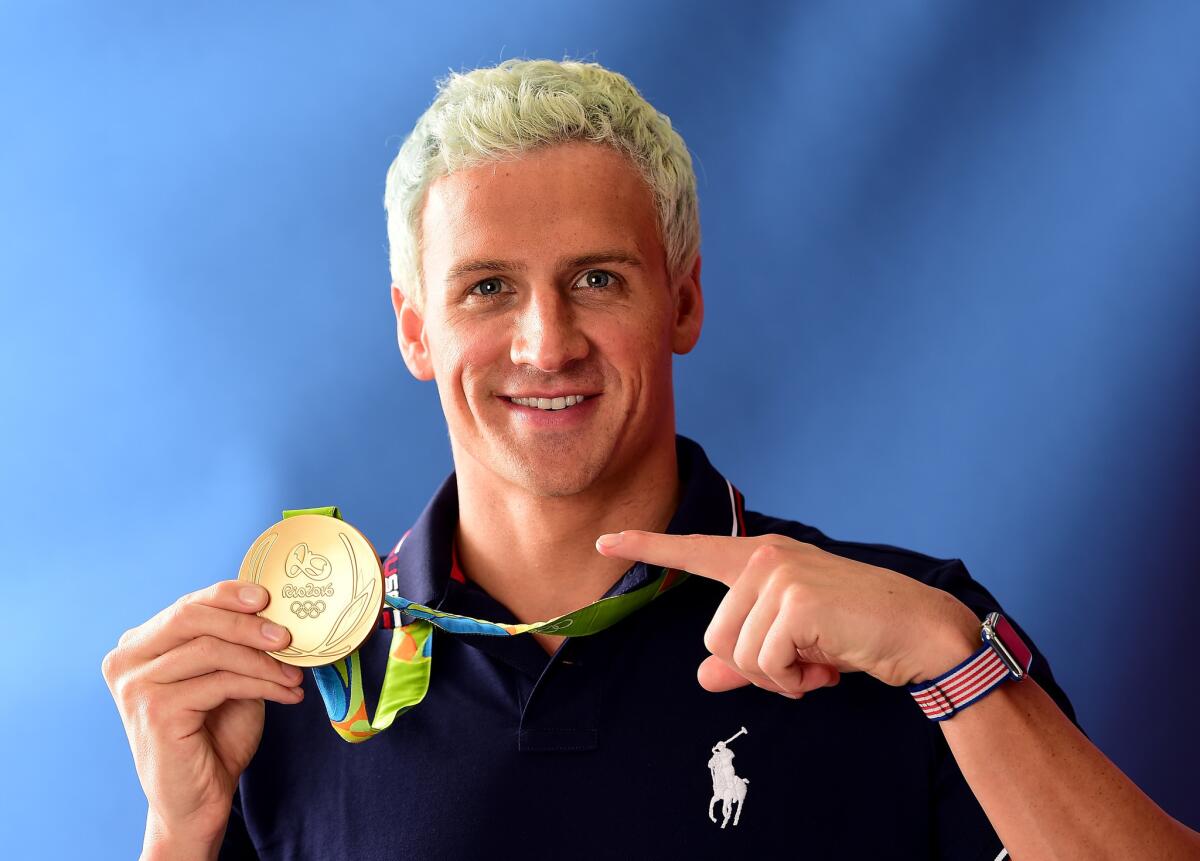 Thieves took his wallet, but Ryan Lochte still has his gold medal.