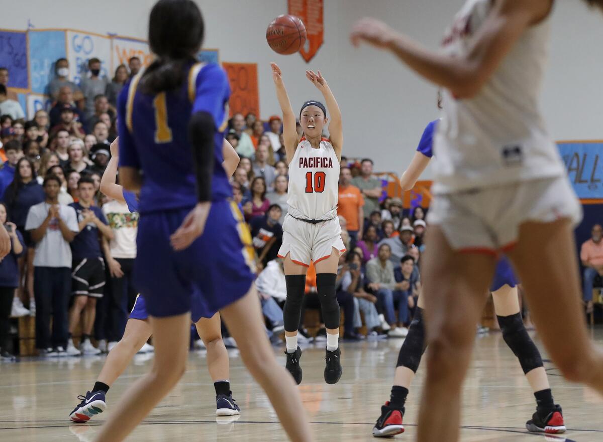 Pacifica Christian guard Lauryn Ham drains a three-point basket during the CIF Division 5A girls' basketball final.