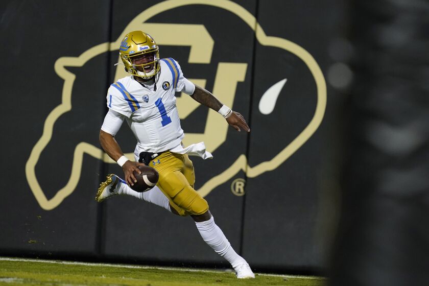 UCLA quarterback Dorian Thompson-Robinson runs for a touchdown against Colorado.