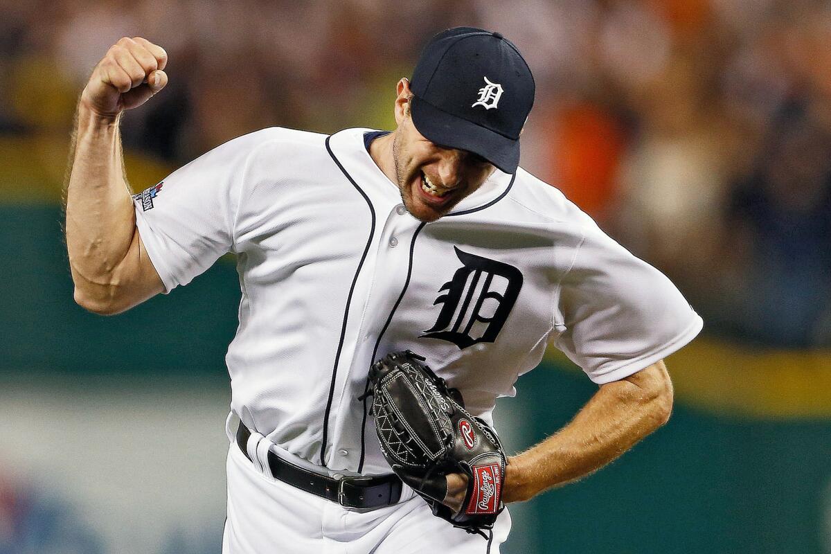 Pitcher Max Scherzer is pumped up after recording an out in the 2013 playoffs. Scherzer will sign a seven-year, $210-million deal with the Nationals.