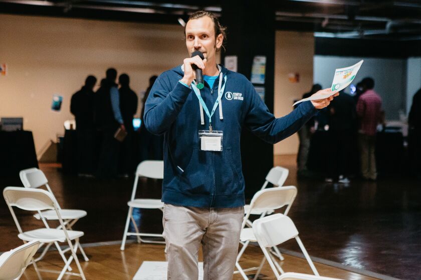 Jarrod Russell, executive director of Startup San Diego, is the only paid employee of the nonprofit organization, while the other 100 members are volunteers.