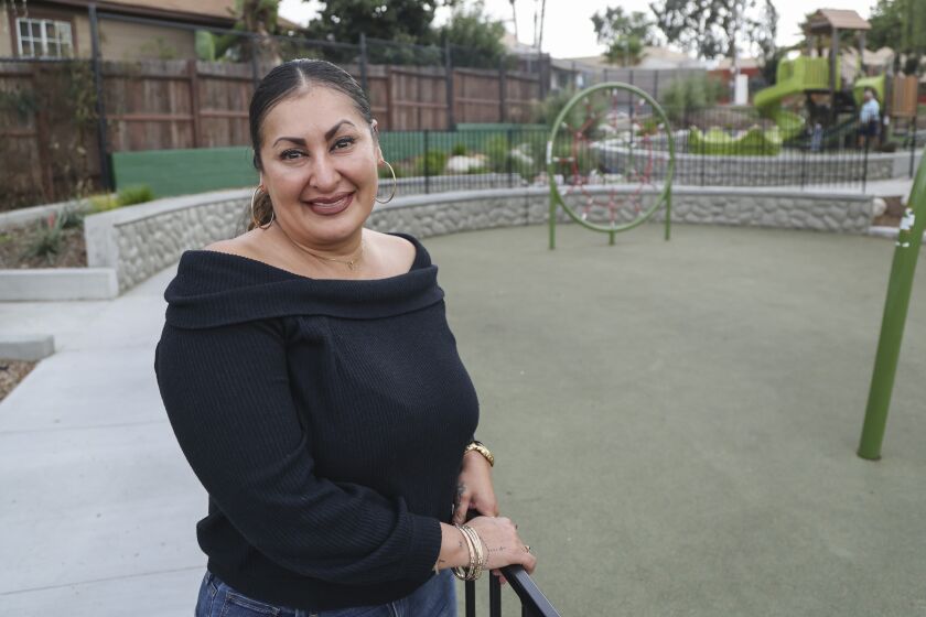SAN DIEGO, CA - OCTOBER 06: Mayra Nunez poses for photos at 41st Mini Park on Wednesday, Oct. 6, 2021 in San Diego, CA. Nunez used to hang out at the park when it was all dirt with a small merry-go-round before it was remodeled. (Eduardo Contreras / The San Diego Union-Tribune)