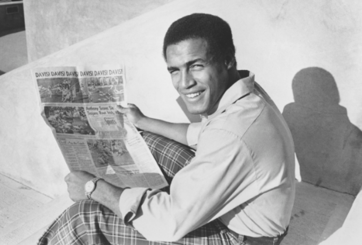 USC running back Anthony Davis holds a newspaper telling of his six touchdowns against Notre Dame on Dec. 6, 1972.