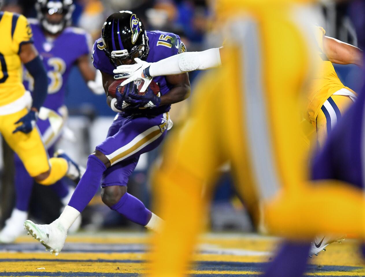 Ravens receiver Marquise Brown catches a touchdown pass against the Rams during the first quarter of a game Nov. 25 at the Coliseum.
