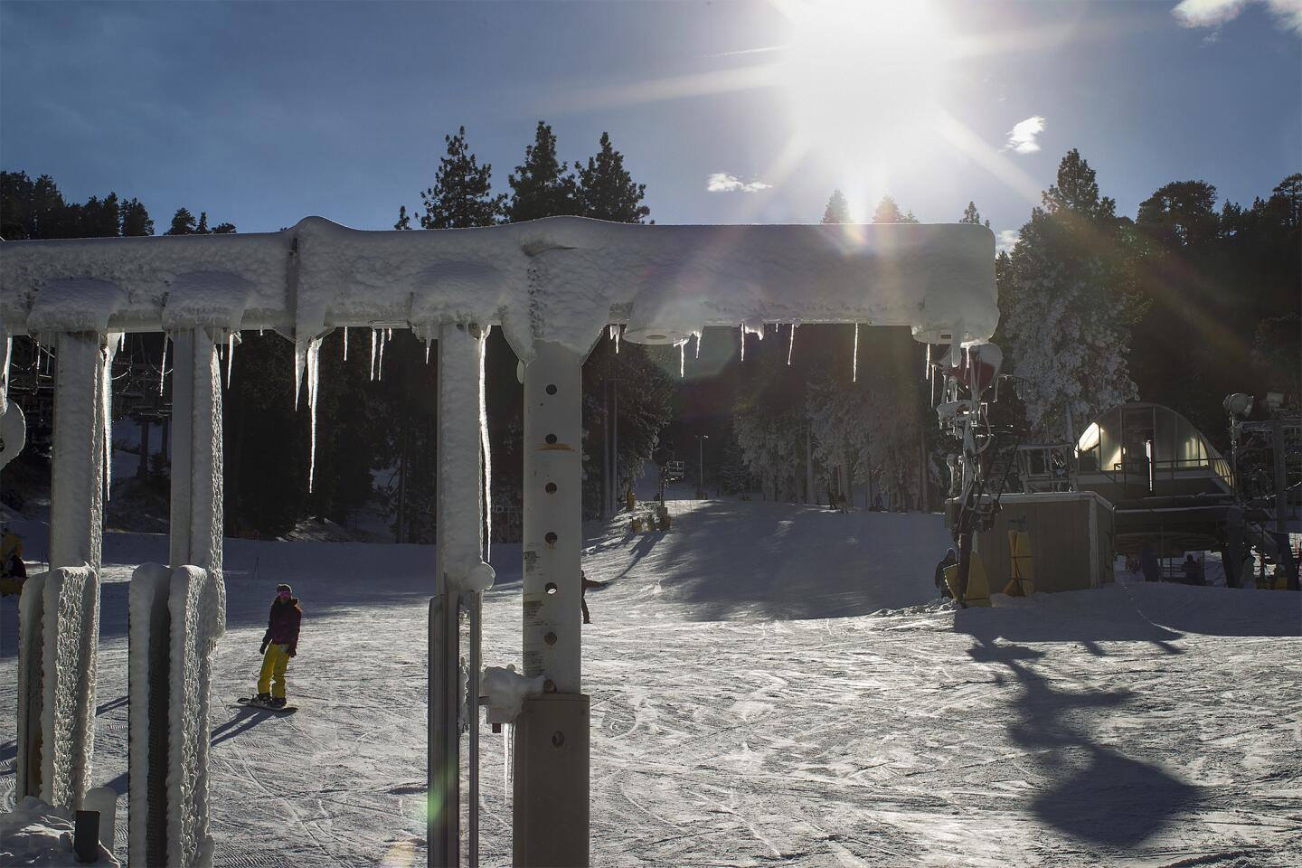 Icicles form while snowboarders enjoy the early ski season at Mountain High Ski Resort in Wrightwood.