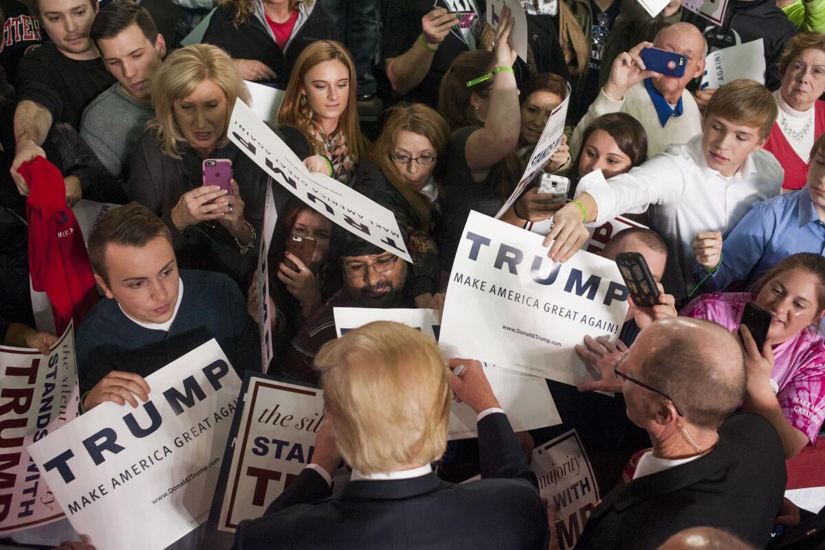 Donald Trump shakes hands and signs autographs with his supporters after speaking at a campaign rally at the Greater Columbus Convention Center in Ohio on Nov. 23.