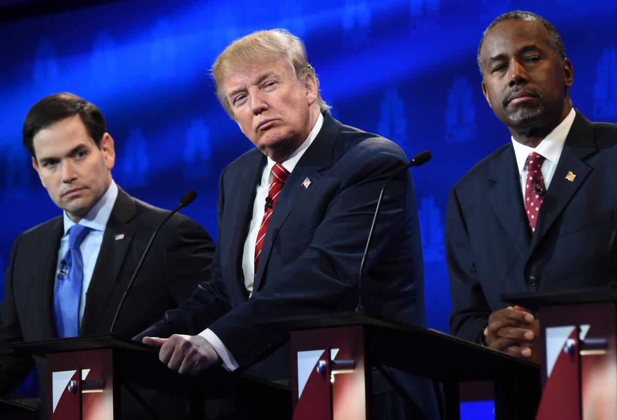 Republican Presidential hopefuls Marco Rubio, Donald Trump and Ben Carson look on during the CNBC Republican Presidential Debate on Oct. 28.
