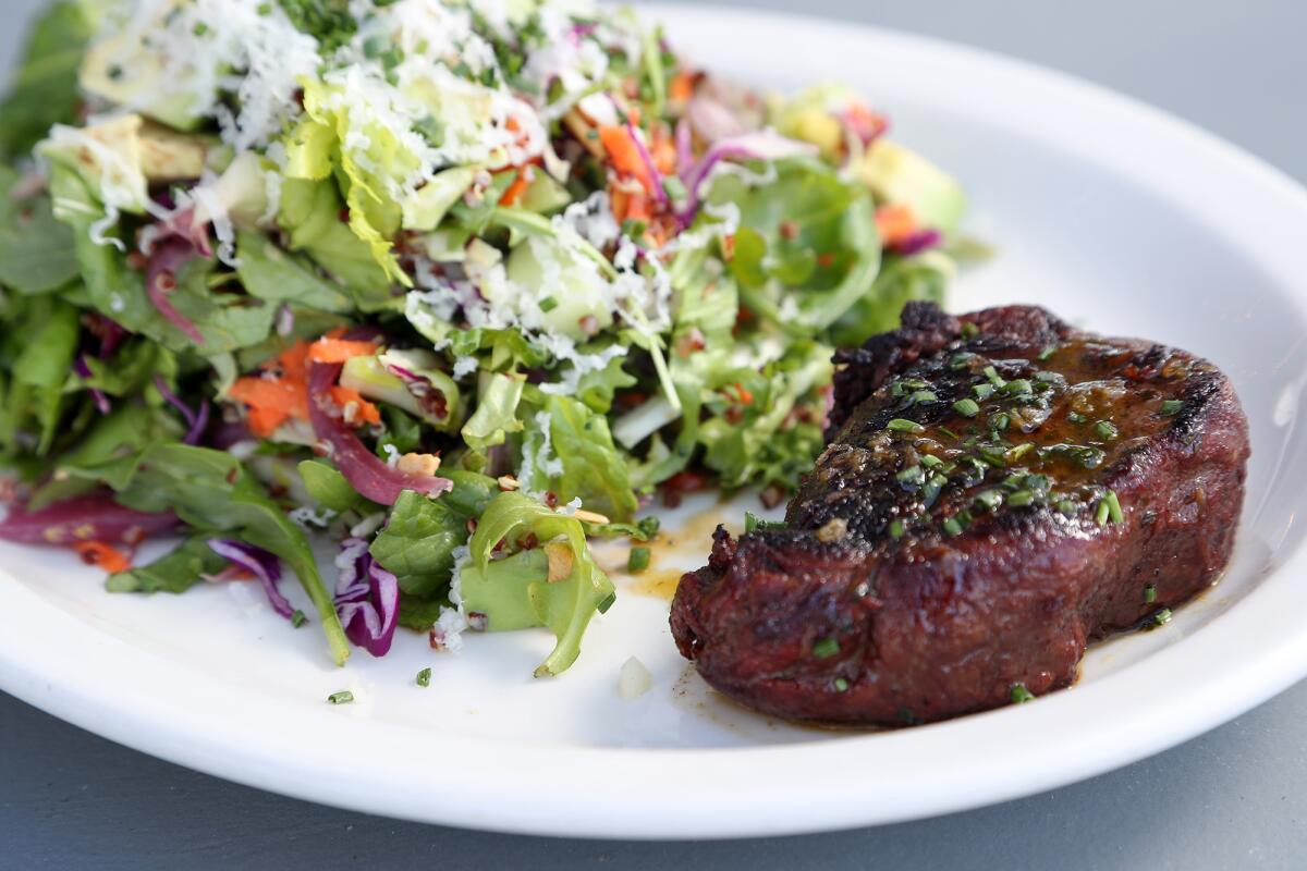A powerhouse steak salad at the recently opened Calico Fish House in Sunset Beach.