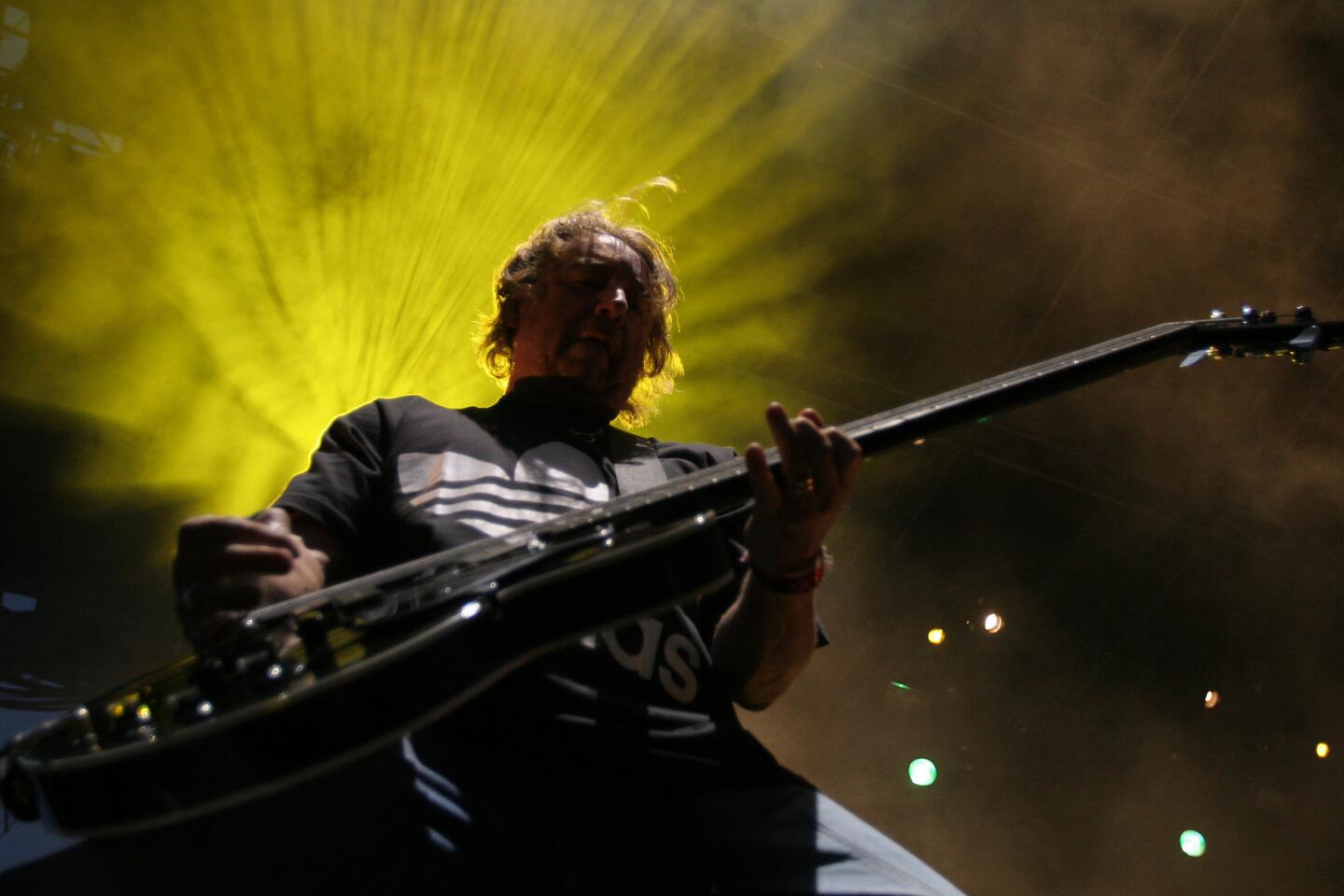 Bassist Peter Hook of New Order performs during the Coachella Valley Music and Arts Festival in 2005 at the Empire Polo Fields in Indio, Calif.
