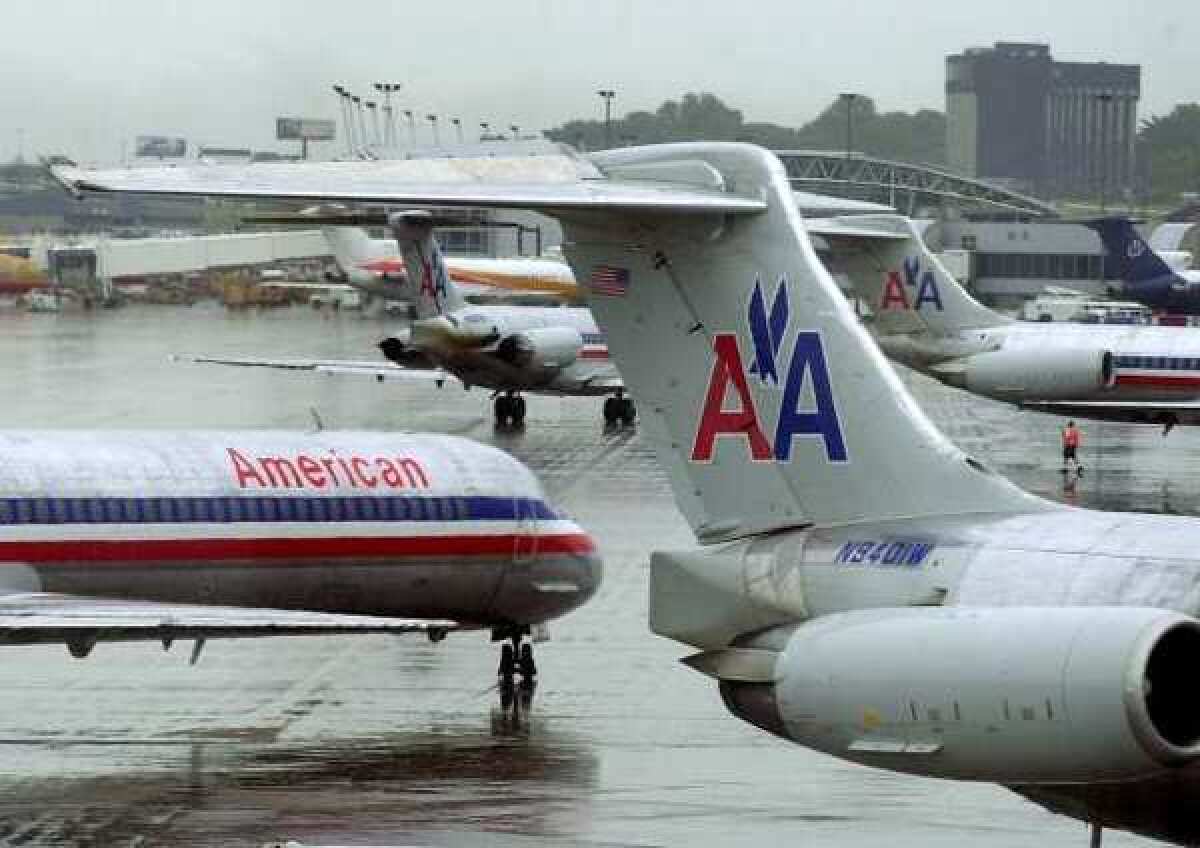 American Airlines passenger aircraft at Lambert International Airport in St. Louis. The airline's parent, AMR, reported a $1.7 billion loss in the first quarter.