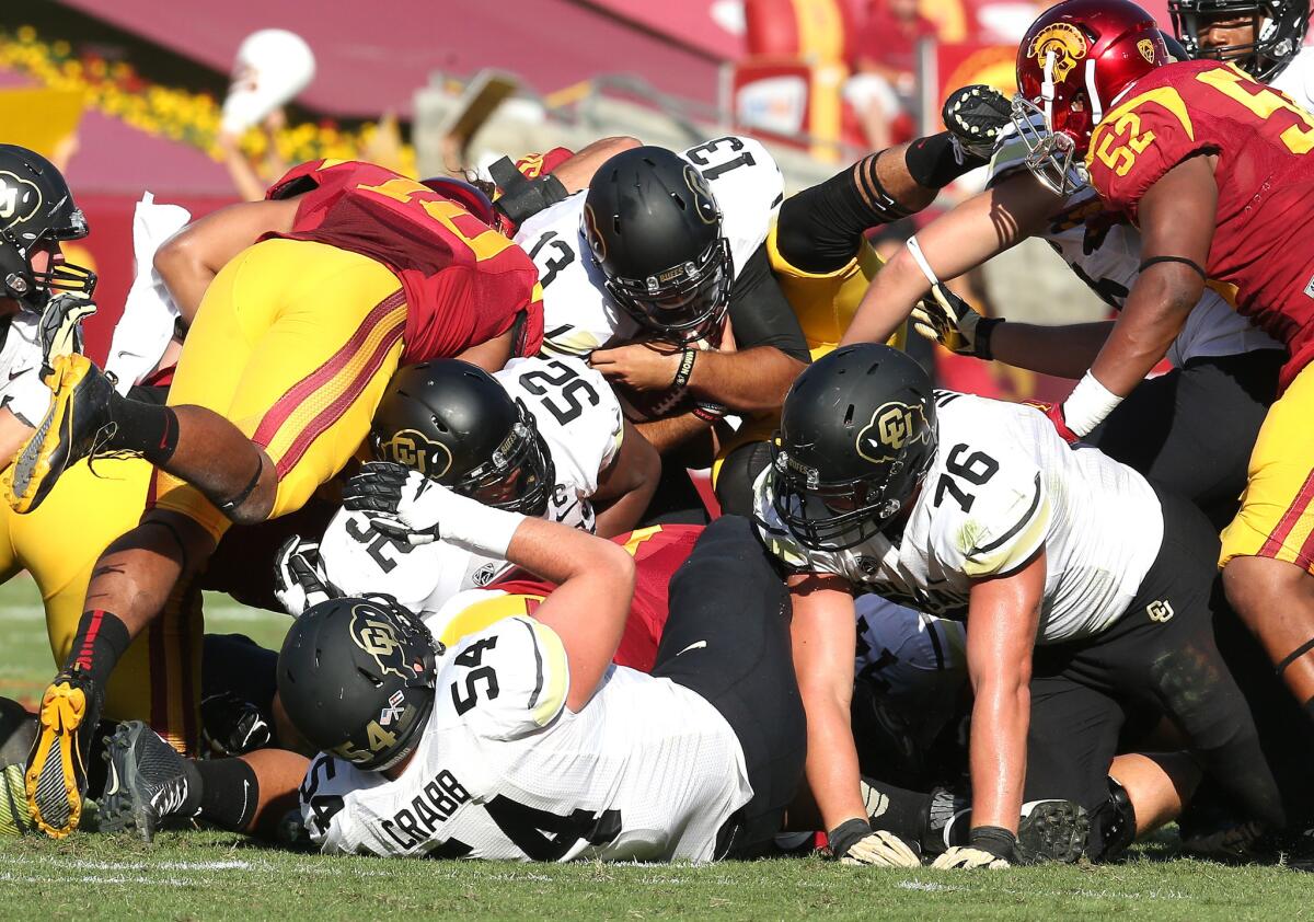 Colorado quarterback Sefo Liufau (13) dives for a first down against USC on Oct. 18. UCLA faces the Buffaloes on Saturday.