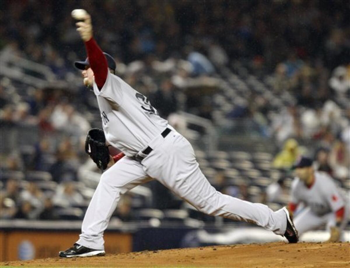 Boston Red Sox starter Jon Lester delivers a pitch in the first inning against the New York Yankees in a baseball game at Yankee Stadium in New York, Monday, May 4, 2009. (AP Photo/Kathy Willens)