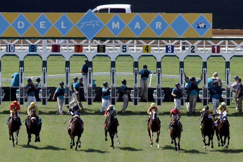 Horses take off from the starting gate Thursday as they run on the turf course in the fourth race on opening day at Del Mar.