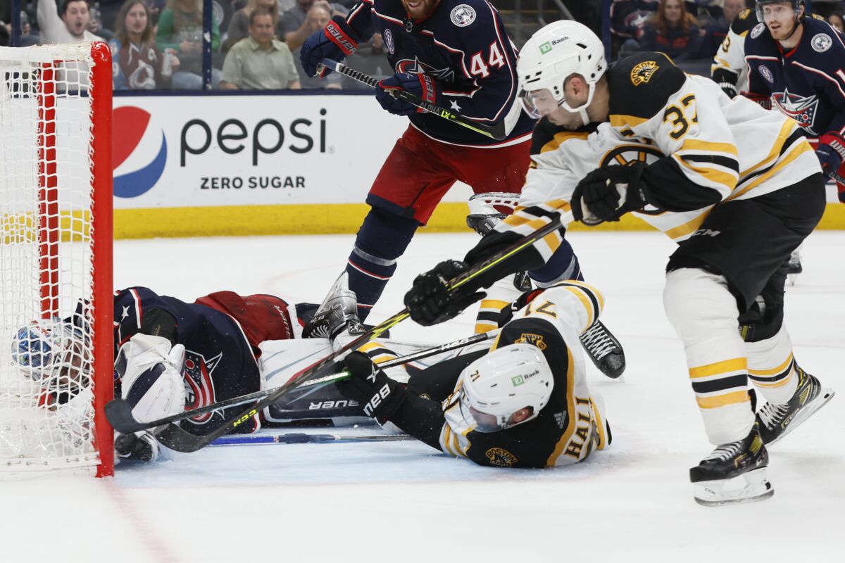 Jake DeBrusk's two third-period goals lift Bruins over Penguins