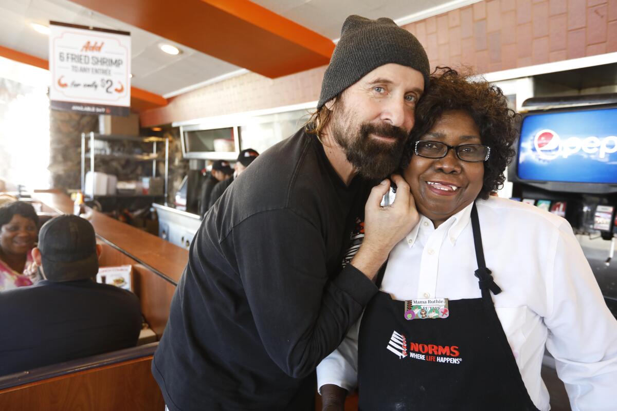 Actor Peter Stormare with his favorite waitress at Norms, Ruthie Krocker. Krocker's smile has been welcoming diners for 44 years.
