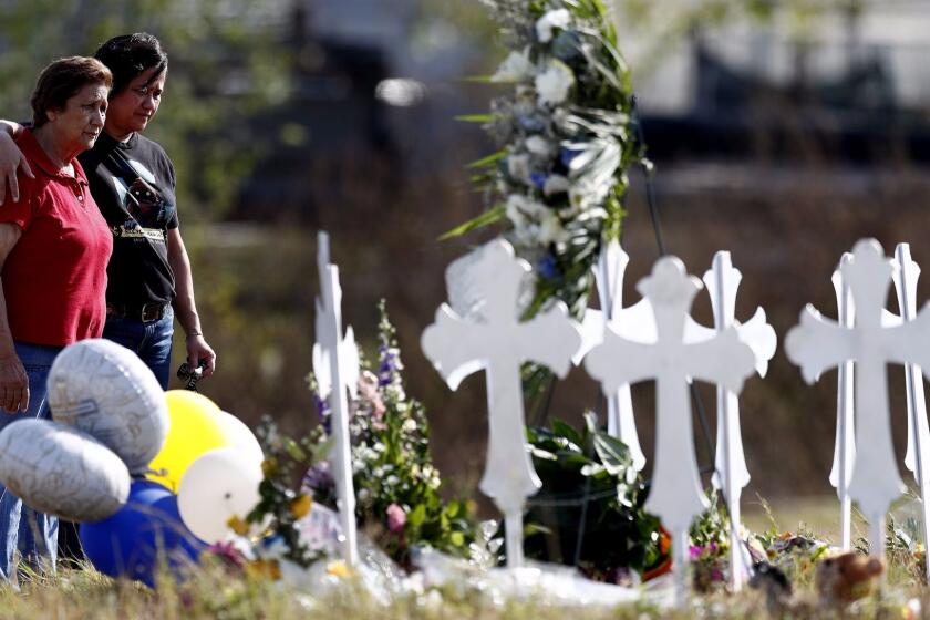 Mandatory Credit: Photo by LARRY W. SMITH/EPA-EFE/REX/Shutterstock (9210233z) Maria Durand (L) a Bible study teachers aid at First Baptist Church of Sutherland Springs covers her face while visiting the twenty six crosses representing the twenty six victims with her daughter Lupita Alcoces (R) in Sutherland Springs, Texas, USA, 07 November 2017. A single gunman identified as Devin Patrick Kelley, 26, is suspected of killing 26 people including several children as they attended church 05 November 2017. Kelley was found dead in his vehicle after a brief chase, however the cause of his death is unclear. Mass shooting in Texas, Sutherland Springs, USA - 07 Nov 2017 ** Usable by LA, CT and MoD ONLY **