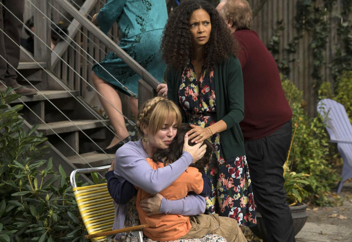 Melissa George, left, Dylan Schombing and Thandie Newton, right, appear in a scene from "The Slap," an eight-hour miniseries premiering on NBC.