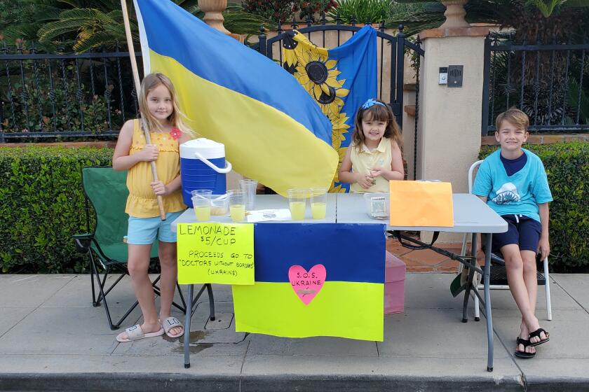 Mary Grace, Anne and Matthew Stuart-Chaffoo at their lemonade stand