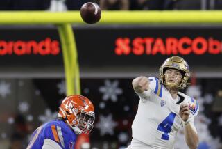 UCLA QB Ethan Garbers throws the ball during the L.A. Bowl